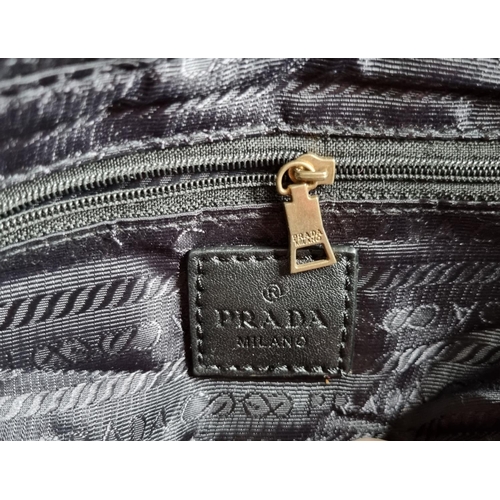 27 - A Prada Milano Hand Bag.