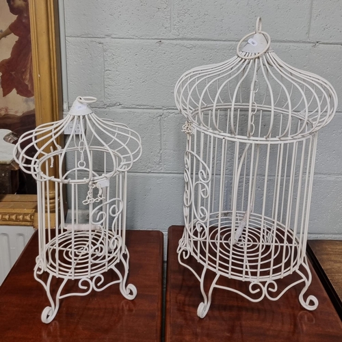 56 - Two modern hanging Bird Cages. H 48,H 66  cms approx.