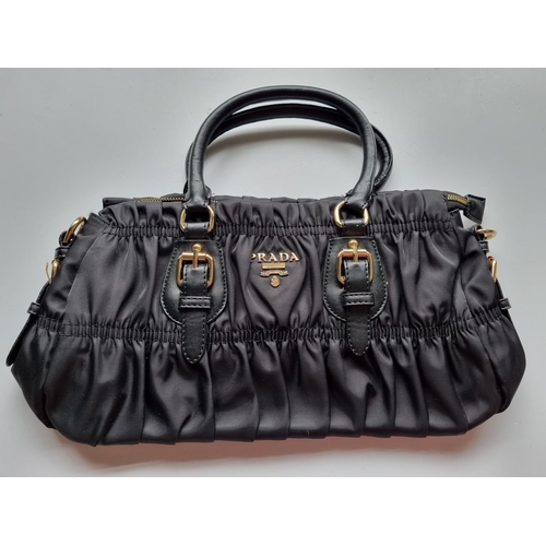 27 - A Prada Milano Hand Bag.