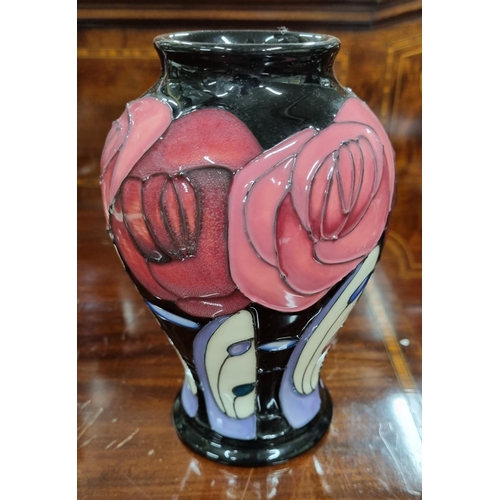 25 - A Moorcroft Pottery bulbous vase. H 16 cm approx.