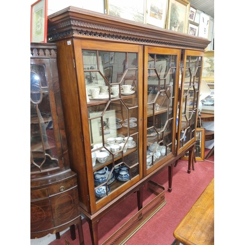 106 - A large 19th Century three door Display Cabinet on a later base with Greek key and pierced cornice, ... 
