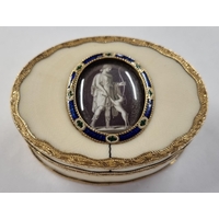 AN IVORY AND 18 CARAT GOLD MOUNTED OVAL SNUFF BOX, 18th Century, the lid inset with an enamel framed medallion "en grisaille" of Diana and her hunting dog, interior lined with tortoiseshell. 8cm wide PLEASE NOTE: THIS ITEM CONTAINS OR IS MADE OF IVORY, and import regulations may vary depending on country.