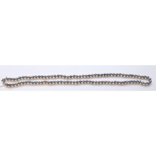 42 - A good long strand of cultured black Pearls. 80 cms long approx.