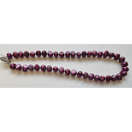 43 - A strand of coloured Cultured Pearls. 40cms approx.