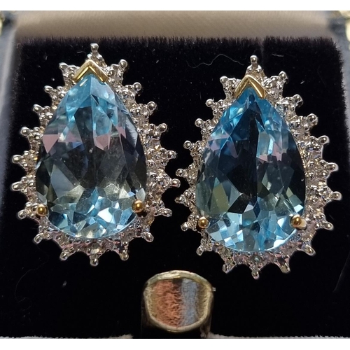45 - A pair of White Gold and Diamond and Topaz Earrings.