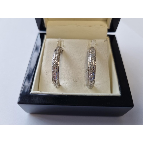 47 - A pair of 18ct White Gold and Diamond Hoop Earrings.