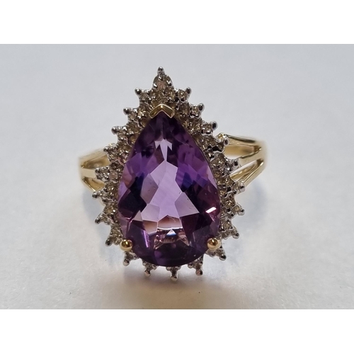 66 - A 9ct Gold Diamond and Amethyst Cluster Ring, size M.