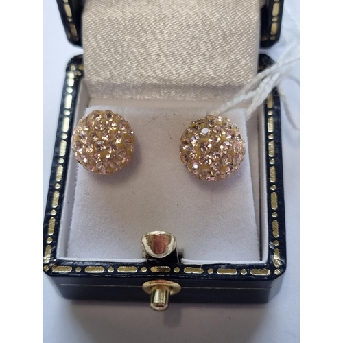 75 - A pair of 9ct Gold Cluster Earrings.