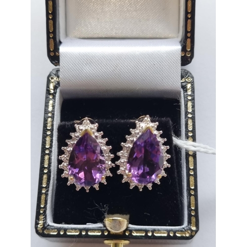 76 - A pair of 9ct Gold, Diamond and Amethyst cluster Earrings.