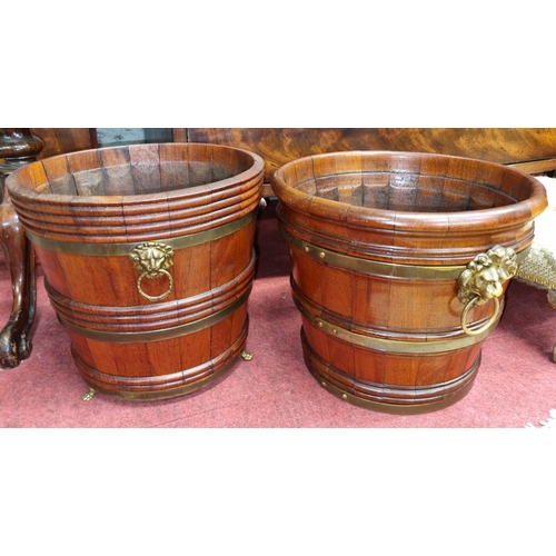 122 - A near pair of 19th Century Champagne Buckets with lions head handles. H 25 Diam. 27, and H 25 Diam.... 