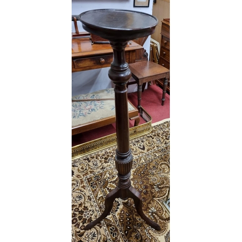 133 - An early 20th Century Mahogany Torchere stand. H 115 x D 23 cm approx.