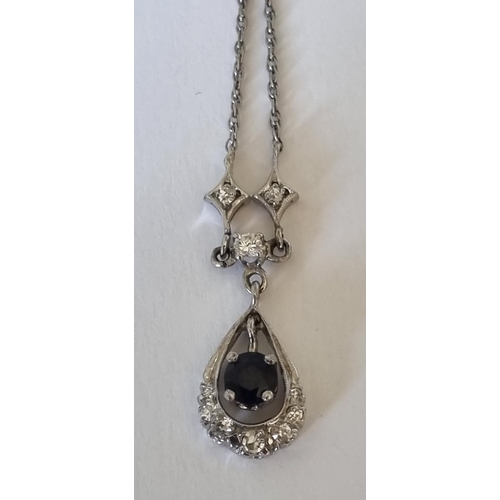 25a - A sapphire and single-cut diamond necklace. Stamped 14K.Length 38.5cms. 3.1gms.