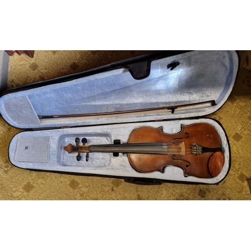 38 - A Violin with Bow and carry case. L 59 cm approx.
