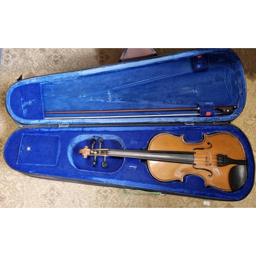 41 - A Violin and bow with carry case.