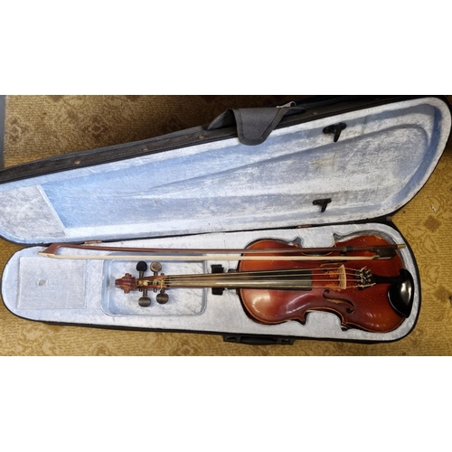 42 - A Violin and bow with carry case.