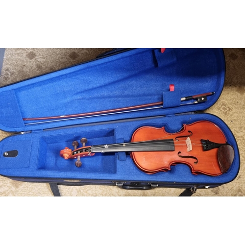 44 - A 3/4 Violin and bow with carry case.