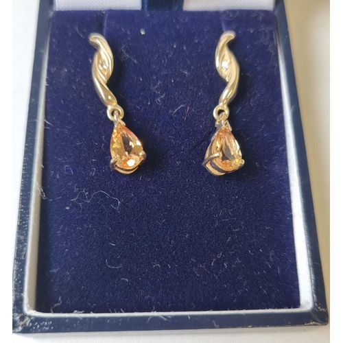 28 - A pair of Gold and Topaz drop Earrings