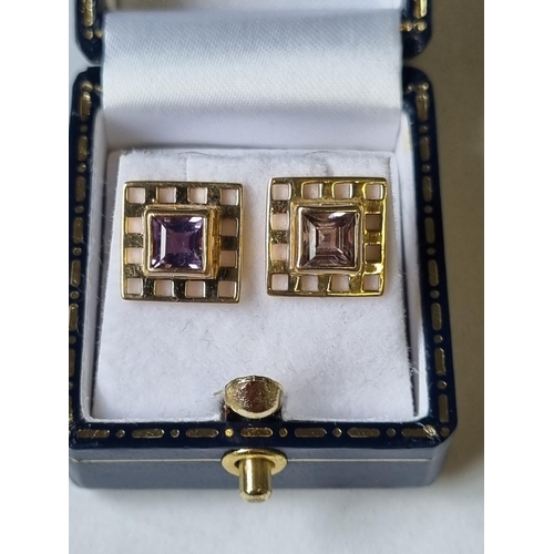 34 - A pair of Gold and Amethyst Earrings.