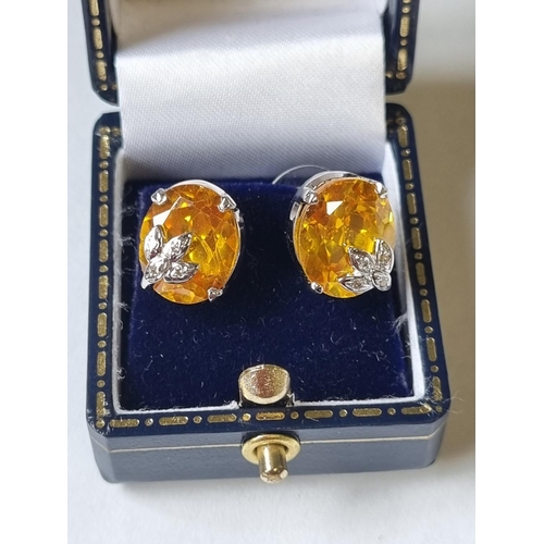 39 - A pair of Diamond and Citrine Earrings.