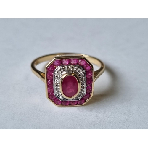 48 - A Diamond and Ruby Cluster Ring, size Q.