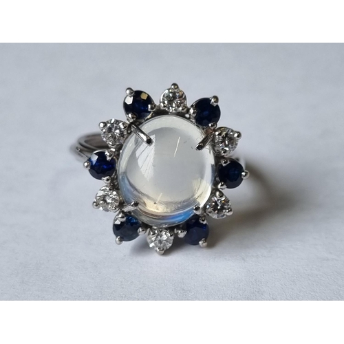 59 - A 18ct Gold, Diamond, Sapphire and Moonstone Ring, Moonstone size approx 12 x 10 mm. Stamped 750, Ri... 