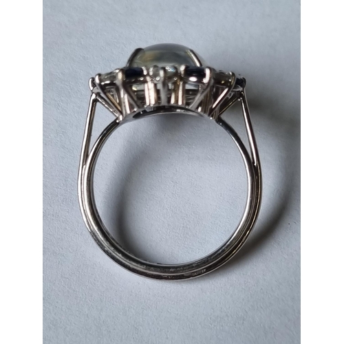 59 - A 18ct Gold, Diamond, Sapphire and Moonstone Ring, Moonstone size approx 12 x 10 mm. Stamped 750, Ri... 