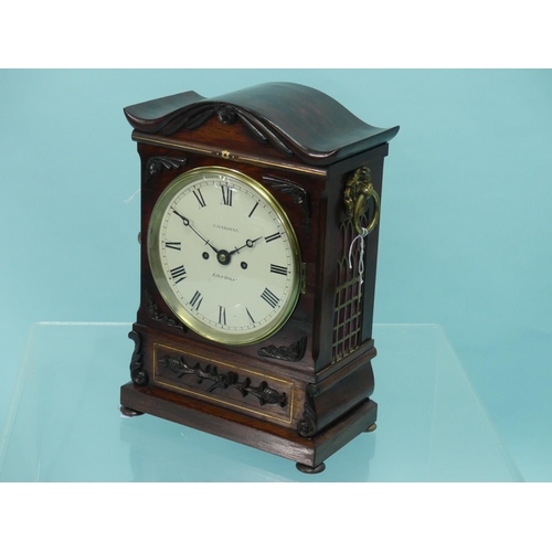 A William IV rosewood Bracket Clock, J. Harding, London, with eight-day twin fusee movement striking on a bell, the painted dial with Roman numerals, signed J. Harding, London, the case with brass inlays, brass handles and pierced brass frets to the sides, the swept pagoda top and applied mouldings above a plinth base and bun feet, 17?in (44.5cm) high.