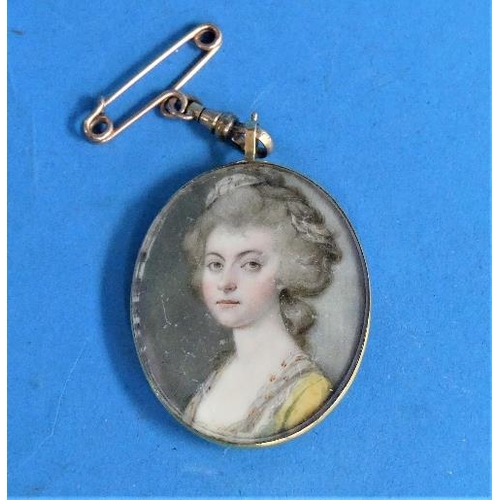 323 - Attrib. to Joseph Daniel (British, 1758-1803), a miniature portrait of a lady, oval, watercolour, in... 