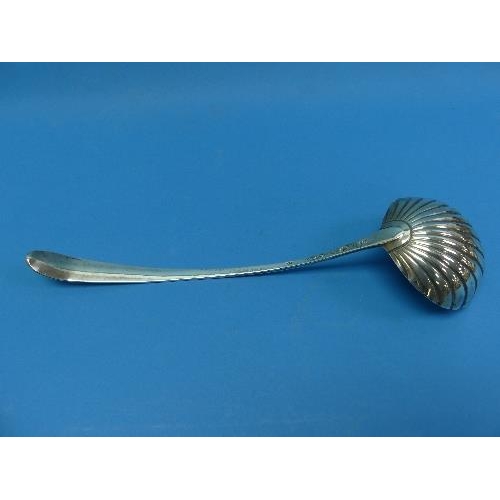 16 - A George III Irish silver Soup Ladle, by Michael Keating, hallmarked Dublin, 1781, with scalloped bo... 