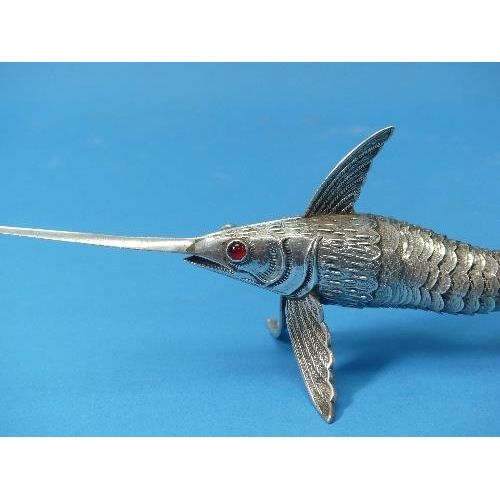 26 - A pair of Spanish silver Articulated Model Sword Fish,  marked on pectoral fins, one with green glas... 