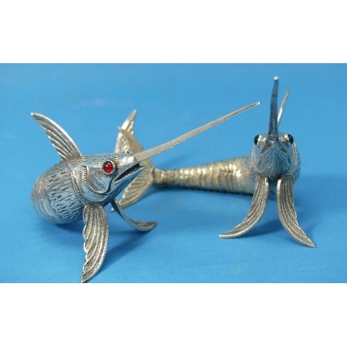 26 - A pair of Spanish silver Articulated Model Sword Fish,  marked on pectoral fins, one with green glas... 