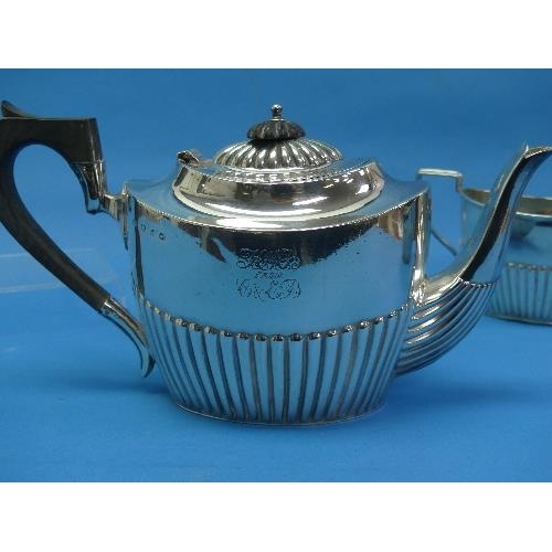 36 - A Victorian silver three piece Tea Set, by Barker Brothers, hallmarked Birmingham, 1895, of oval for... 