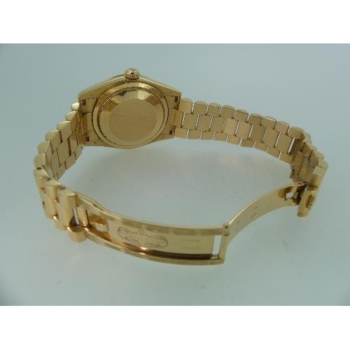 360 - Rolex: A gentleman's 18ct gold Rolex Oyster Perpetual Day-Date Wristwatch, the circular face with fl... 