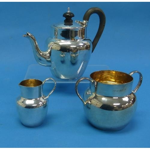 58 - An Edwardian silver three piece 'bachelor' Tea Set, by H J Cooper & Co Ltd., hallmarked Birmingham, ... 