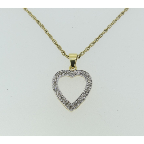 179 - An 18ct yellow gold open heart shaped Pendant, set with diamond points, marked 750, 1.8g, on a 9ct g... 