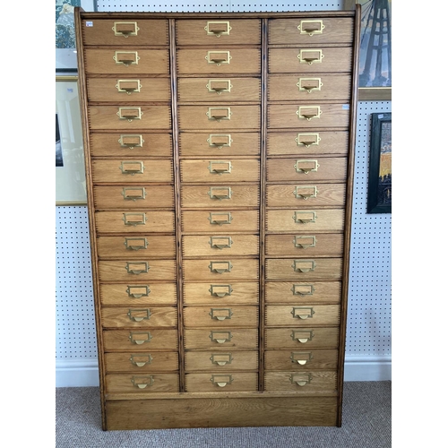 494 - An early 20thC oak industrial Card Index Chest, the three quarter gallery upon the forty-five drawer... 