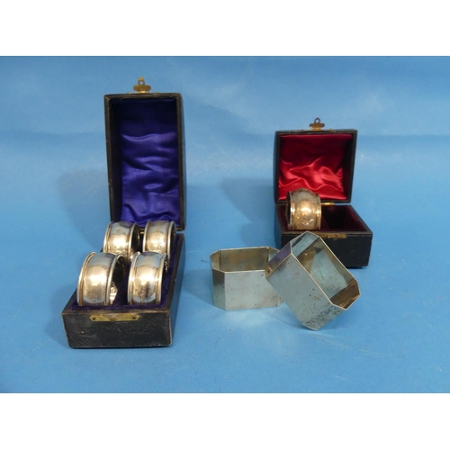 47 - A cased set of four Edwardian circular silver Napkin Rings, by Constantine & Floyd Ltd., hallmar... 