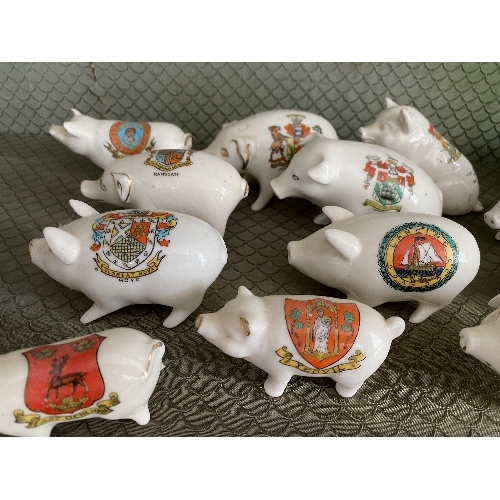 2 - A large quantity of Crested China Pigs, all painted with different crests and place names, with fact... 