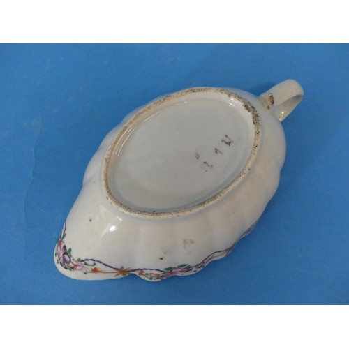 43 - An 18thC Chinese Export Armorial Porcelain Sauce Boat and Saucer, bearing the crest of the Scottish ... 