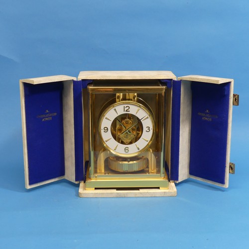 479 - A Jaeger Le Coultre Atmos Clock, the 10.75cm white chapter ring with Arabic numerals enclosing an op... 
