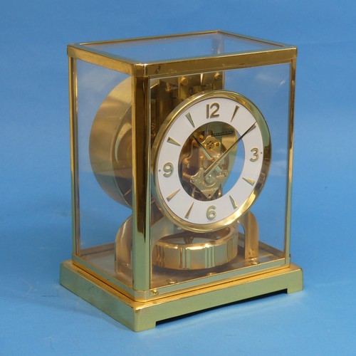 479 - A Jaeger Le Coultre Atmos Clock, the 10.75cm white chapter ring with Arabic numerals enclosing an op... 