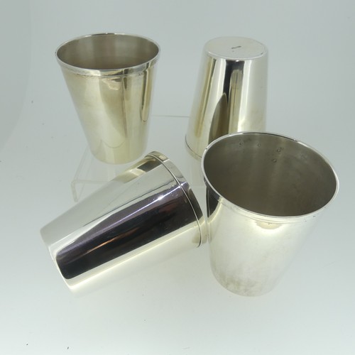 13 - A set of four graduated silver Beakers, of plain form, the bases marked 'Sil-Ver' and 'JBCo', approx... 