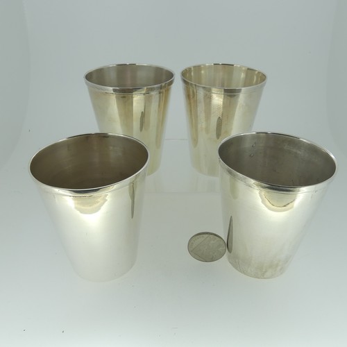 13 - A set of four graduated silver Beakers, of plain form, the bases marked 'Sil-Ver' and 'JBCo', approx... 
