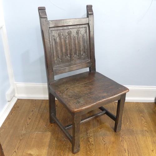 A period oak Side Chair, with linen fold carved back, W 55cm x H 104.5cm x D 55cm.