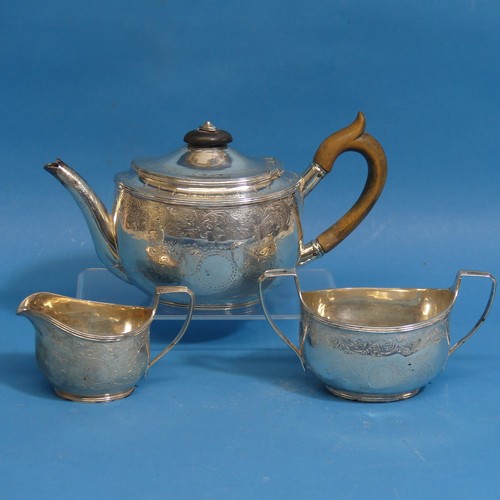 5 - A Victorian silver three piece Tea Set, by Robert Harper, hallmarked London 1881, of small oval form... 