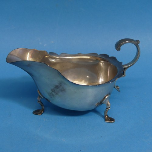 9 - A George V silver Sauce Boat, by Martin, Hall & Co., hallmarked Sheffield, 1912, of typical form... 