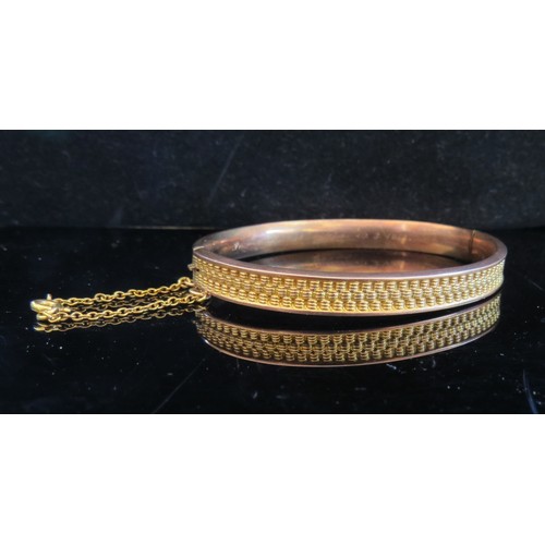 5001 - A Victorian 9ct gold bangle, woven design, inscribed to inside In Memory of Mittie, 10.3.1913, 8.8g