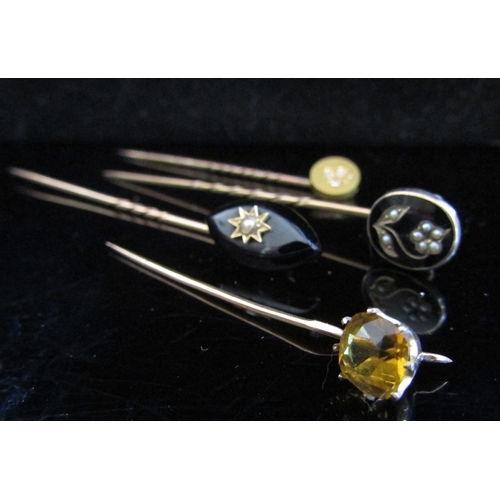 5010 - Two Victorian memoriam stick pins, black enamel and jet with pearl examples, a gold diamond set and ... 