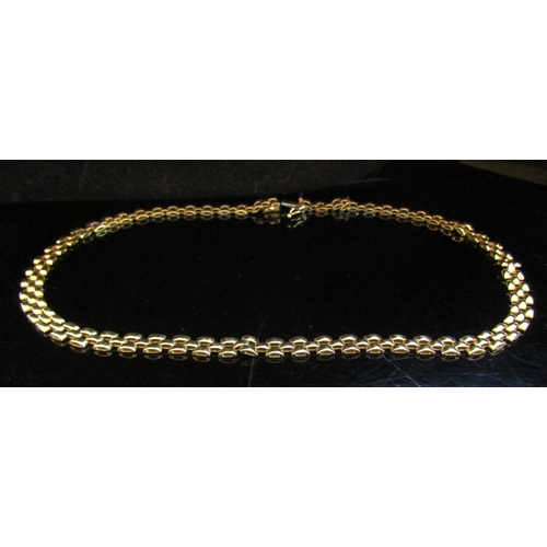 5016 - A 9ct gold fancy flat link necklace, 41cm long, 17.1g