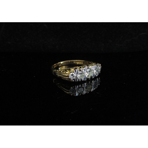 5030 - An 18ct gold five stone diamond ring. Size Q, 5.5g